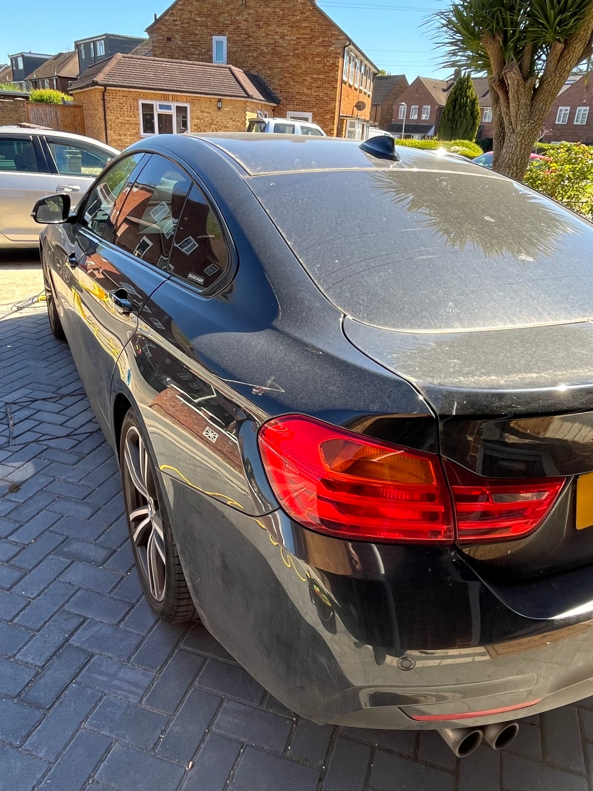 The same BMW before detailing, finish dusty and covered in dried water spots
